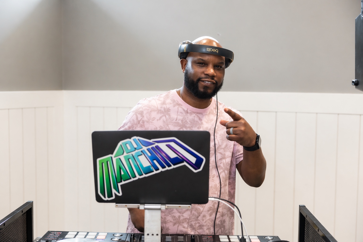 DJ Manchild performing behind his DJ controller
